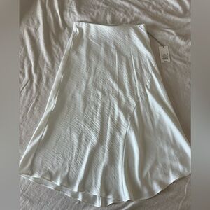 White satin midi skirt, size small. New with tags